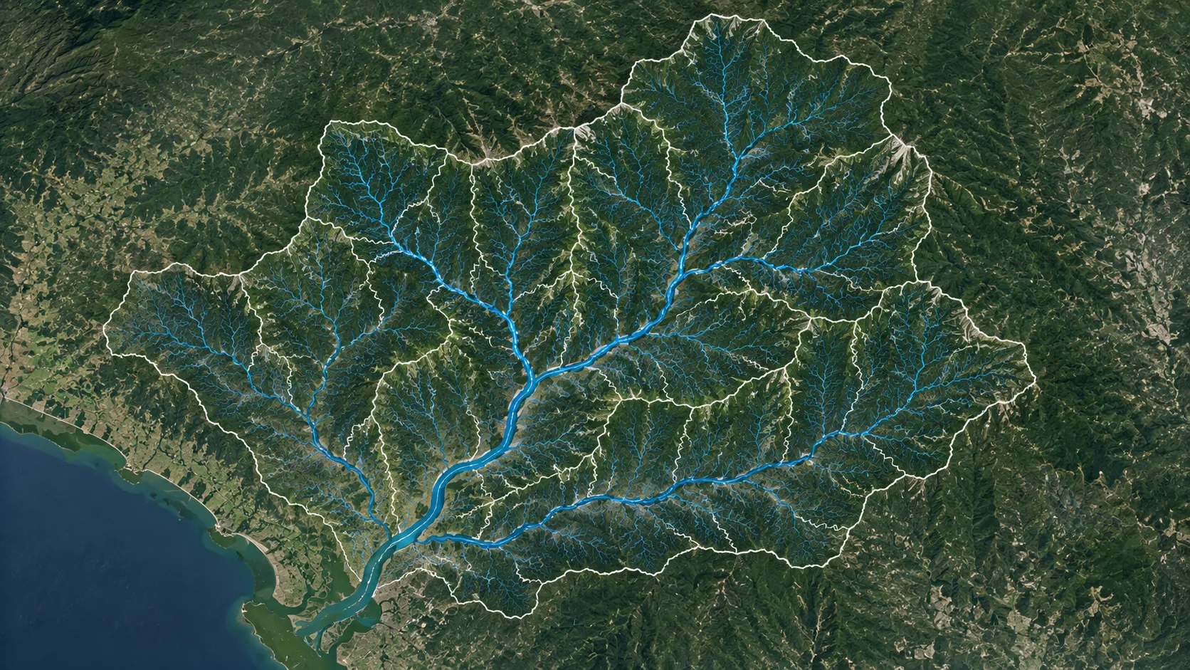A satellite view of a watershed with the drainage network in blue and the basin boundary outlined