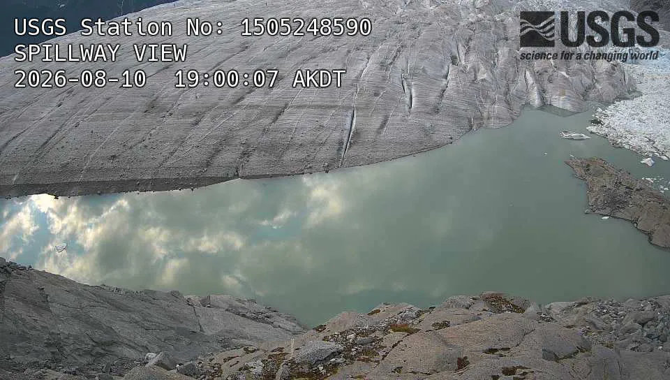 The Suicide Basin spillway with water flowing over the ice dam on August 10, 2026